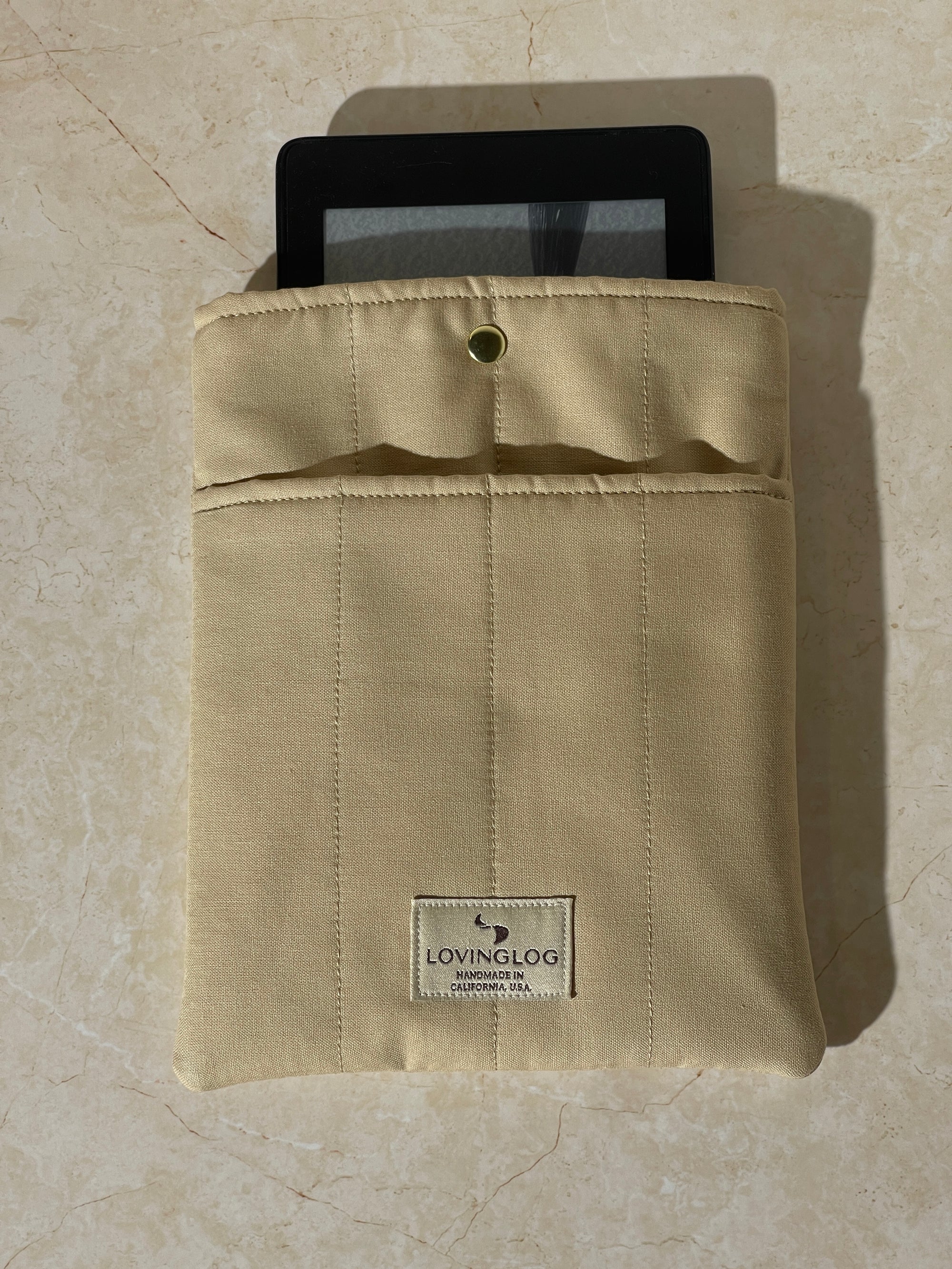 Lovinglog Sustainable khaki cotton Books, Kindle Sleeve on a beige surface